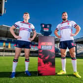 England duo Harry Newman - of Leeds Rhinos - and Mike McMeeken, who will join Wakefield Trinity in pre-season, with the ABK Beer Test Series trophy at AMT Headingley ahead of Saturday's clash with Samoa. Picture by Allan McKenzie/SWpix.com.