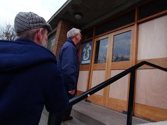 Church officials at Cookridge Methodist Church were left counting the cost after vandals repeatedly smashing windows in December 1998. Pictured are David Hails and Colin Hutchinson.