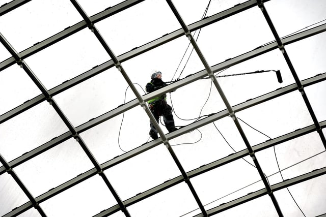 The glass roof gets a final cleaning ahead of opening. There are 1,902 separate panes of glass the dome roof and 918 LED lights.