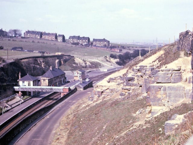Looking towards Morley Low Station and Daisy Hill from the station steps along the path passing by the Miners' Arms in April 1962. The houses from the brow of the hill sloping down to the railway line are still occupied, but there is no new building as yet on this part of the hill. Much of the land is being used for market gardening. Some of the shaping of the sandstone blocks on the right hand side looks to date back to the era of Morley Main Colliery whose spoil heap covered much of the land behind the right hand wall.