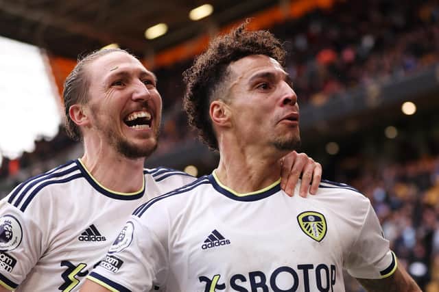 WOLVERHAMPTON, ENGLAND - MARCH 18: Rodrigo Moreno of Leeds United celebrates with teammate Luke Ayling after scoring the team's fourth goal during the Premier League match between Wolverhampton Wanderers and Leeds United at Molineux on March 18, 2023 in Wolverhampton, England. (Photo by Naomi Baker/Getty Images)