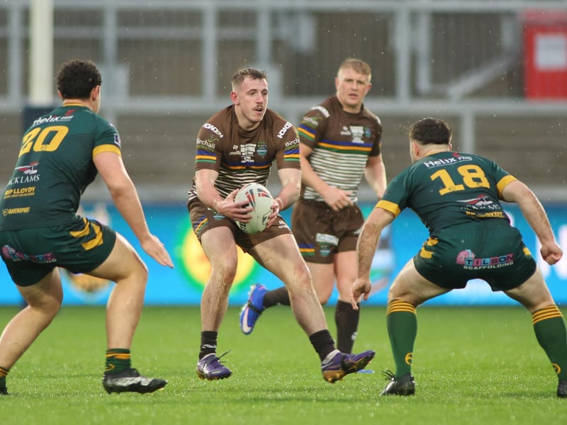 Joe Abson in possession, with Harry Shackleton providing support, for Hunslet ARLFC in the National League Premier Division Grand Final against West Hull at Wakefield Trinity.