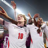Jubilant England players celebrate their victory over Mexico which saw them go through to quarter-finals of the World Cup and a tie against Norway tonight.