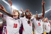 Jubilant England players celebrate their victory over Mexico which saw them go through to quarter-finals of the World Cup and a tie against Norway tonight.