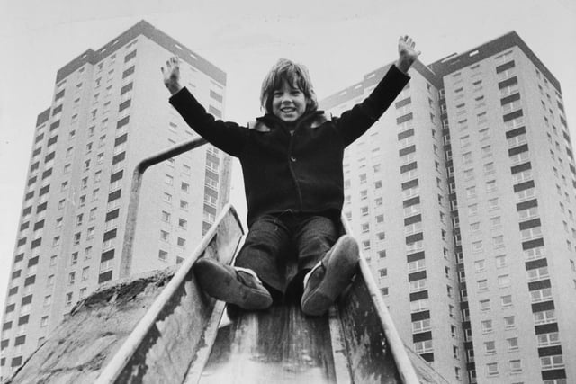 The flats at Cottingley boasted a new adventure playground in October 1972. Pictured is Philip Darby at the top of a slide.