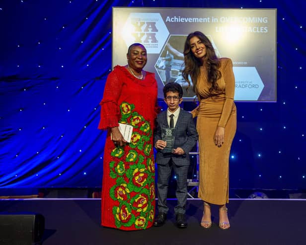 Achievement in Overcoming Life Obstacles winner Muhammad Waqar Ahmed (centre) receiving the award from Professor Uduak Archibong MBE  (left), with YAYAs host Noreen Khan (right). PIcture: Roger Moody