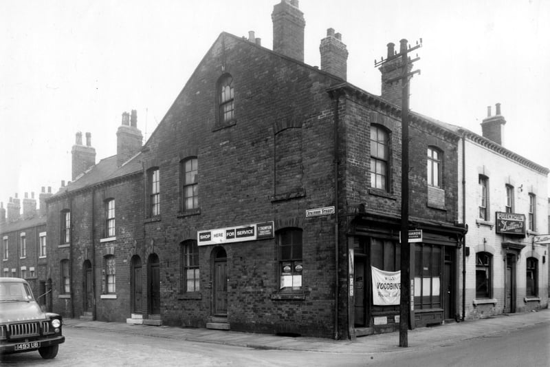 Atkinson Street from the junction with South Accommodation Road in August 1961. Fred Thompson tobacconist and confectioner occupies the premises on the corner at no 81 South Accomodation Road. The Queen Hotel can be seen far right and the building extends back behind Atkinson Street.