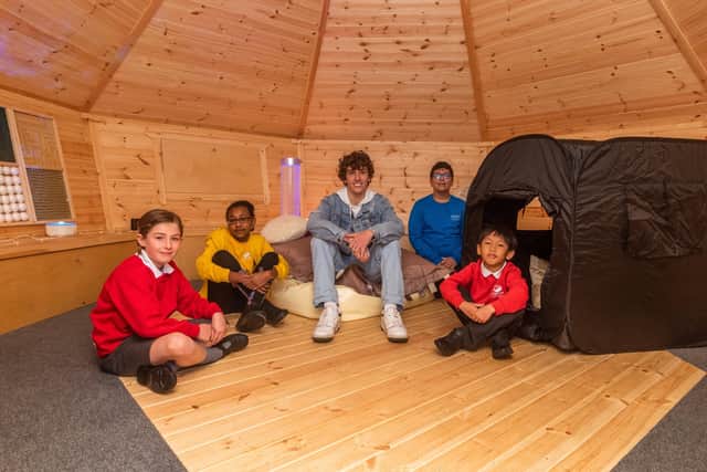 The new sensory hub at Allerton CofE Primary School is complete with mood lighting, soothing music and an “infinity mirror” - and has so far been explored by students Isabel and Tiyahna, pop star Nath Brooks, and students Mohammed and Eden. Photo: James Hardisty.