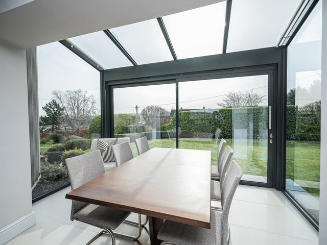 This open dining area has doors leading out to the garden, so is an ideal set-up for summer entertaining.