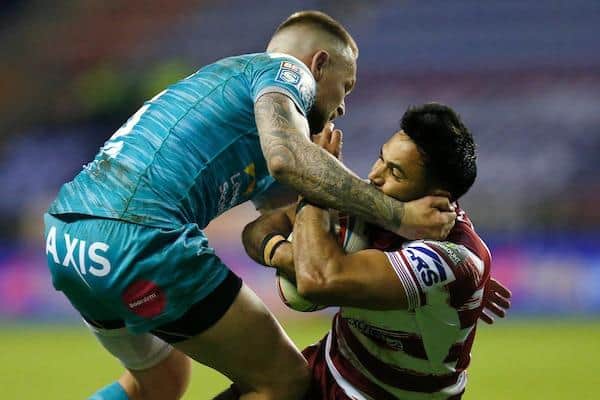 Rhinos' Blake Austin tackles Bevan French during the win at Wigan. Picture by Ed Sykes/SWpix.com.