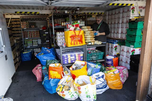 Wrenthorpe Kirkhamgate Assist food bank volunteers pack food parcels for people ready for collection and delivery. Picture: Lee Mclean/SWNS