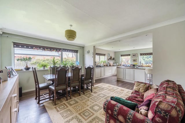Open access leads to a formal dining area, ideal for those who enjoy entertaining guests.