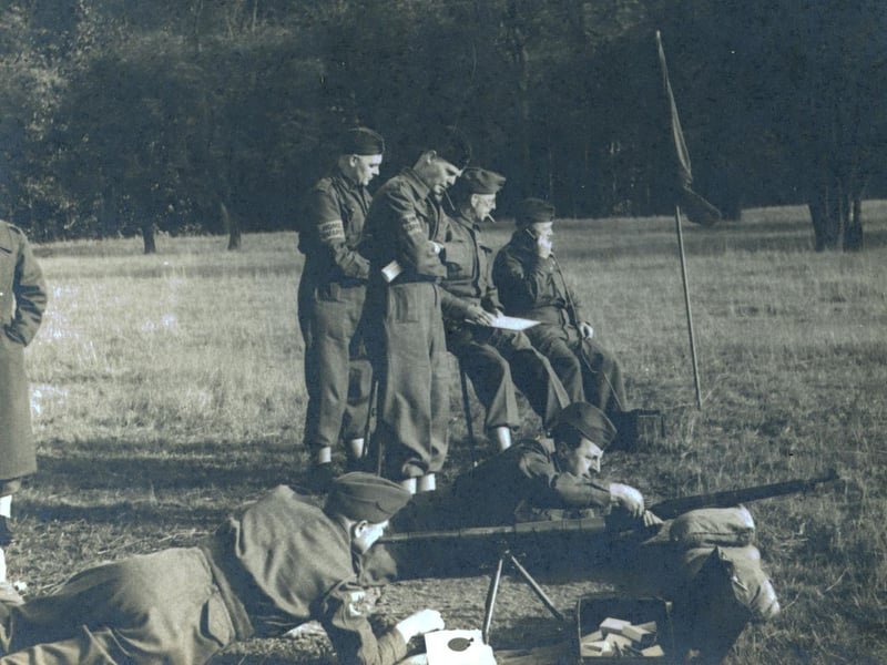 Sniper training 303 target shooting telescope, probably Harewood Park Sept 1940. The rifle did not have a telescopic site, so the spotter would use the telescope to locate the target and direct the sniper.