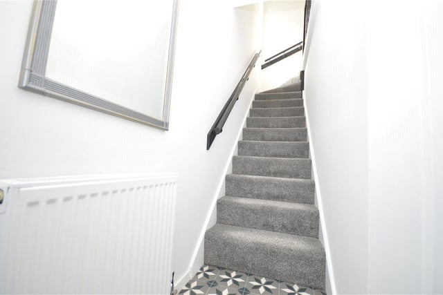 The stairs lead to the first floor where the bedrooms can be found.
