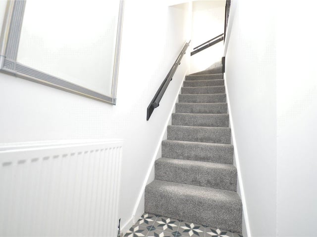 The stairs lead to the first floor where the bedrooms can be found.