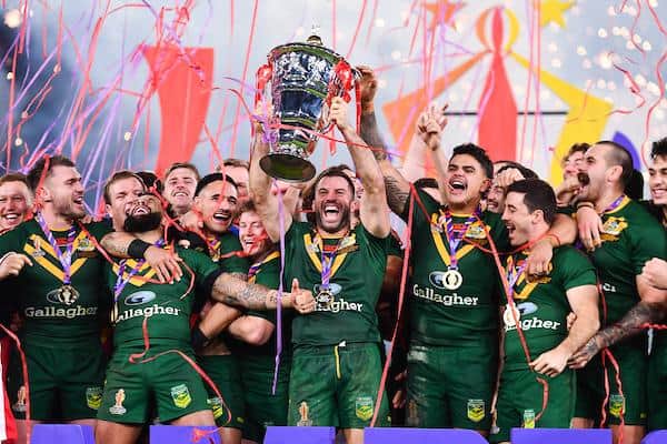 James Tedesco lifts the trophy as Australia's men celebrate yet another World Cup success. Picture by Will Palmer/SWpix.com.