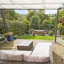 The stunning garden and backdrop to the terraced property.