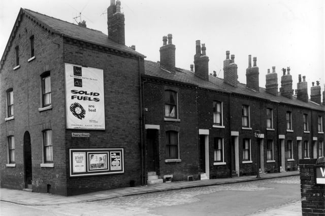 Prospect Street and Beza Street in July 1961. A large poster on the end of Prospect Street promotes the use of solid fuel.