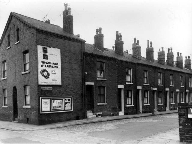 Prospect Street and Beza Street in July 1961. A large poster on the end of Prospect Street promotes the use of solid fuel.
