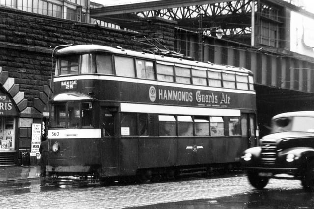 Tram no 560, pictured at Mill Hill on route 26 to Balm Road in July 1956. Advert for 'Hammonds Guards Ale' can be seen on side of tram.