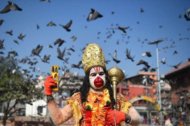 A Hindu holy man dressed as the monkey god Hanuman ahead of Maha Shivaratri at the Pashupatinath temple in Kathmandu in February 2018 (Photo: PRAKASH MATHEMA/AFP via Getty Images)