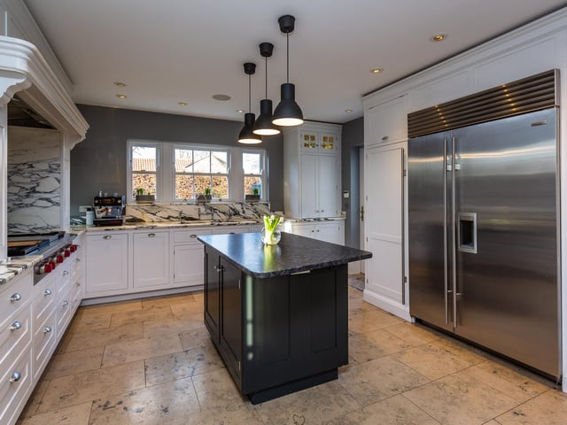 The stunning open plan kitchen with central range.