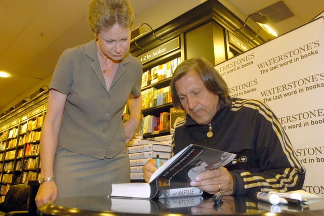 Tennis veteran Ilie Nastase signing his book at Waterstones in Leeds city centre, pictured with Carol Haughton, from Rothwell, on June 22, 2004.