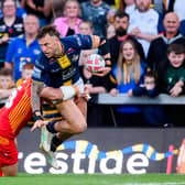 Leeds Rhinos' Chris Hankinson is tackled by Catalans Dragons' Ben Garcia. Picture by Allan McKenzie/SWpix.com.