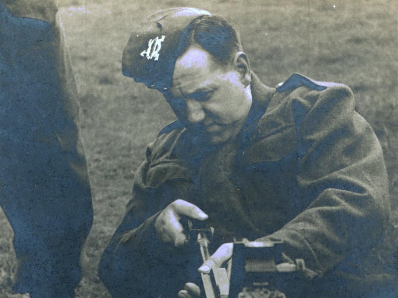 This photo is entitled 'A Demonstration of Stripping, Becketts Park, Spring 1941'. The image shows stripping and cleaning a Browning Machine Gun in Becketts Park in Headingley, which was used as a training centre during WWII, mostly for training medical orderlies.