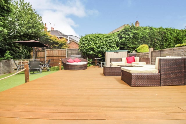 Lawn, imitation grass and decking area all help to compliment the size of the garden