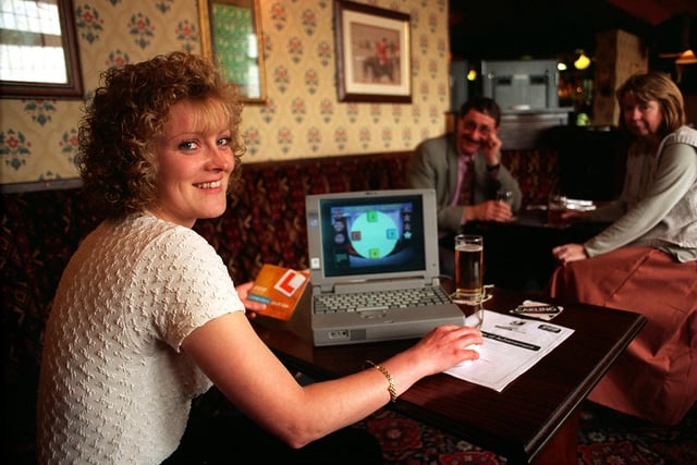 Karen Hunter, from Belle Isle, Leeds, gets to grips with computer technology with the help of Leeds Library and Information Services, who were running the BBC 'Computers Don't Bite' campaign at The Wellington pub in Hunslet.