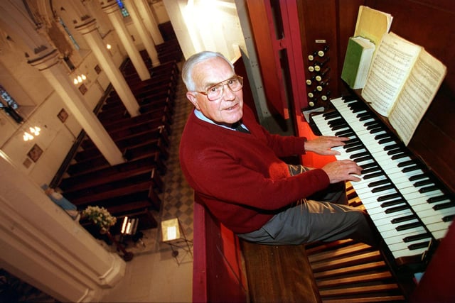 Church organist Stanley Ibbotson at the organ high above the pews at St Saviour's Church in  Richmond Hill. Pictured in November 1998.