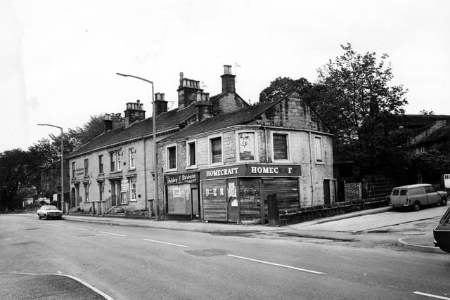 A parade of shops and businesses on Upper Town Street, opposite the junction with Bell Lane in May 1979. In focus is the Beecrofts Land and Estate Agent Auctioneers and Valuers, then the boarded up premises of the Shirley and Barbara Hair Stylists and the boarded up premises of the Homecraft Store.
