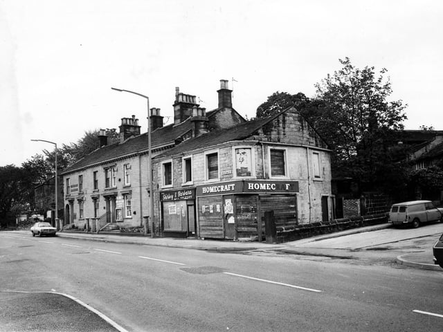 A parade of shops and businesses on Upper Town Street, opposite the junction with Bell Lane in May 1979. In focus is the Beecrofts Land and Estate Agent Auctioneers and Valuers, then the boarded up premises of the Shirley and Barbara Hair Stylists and the boarded up premises of the Homecraft Store.