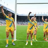Rhinos players celebrate their win over Castleford at last year's Magic Weekend in Newcastle. Picture by Will Palmer/SWpix.com.