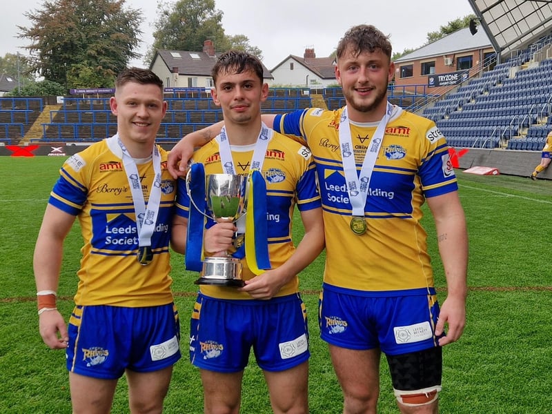 Rhinos' reserves topped the table and beat Warrington 8-0 in their Grand Final. Elliott Fox, Harry Smith and Noah Whittingham are seen with the trophy.
