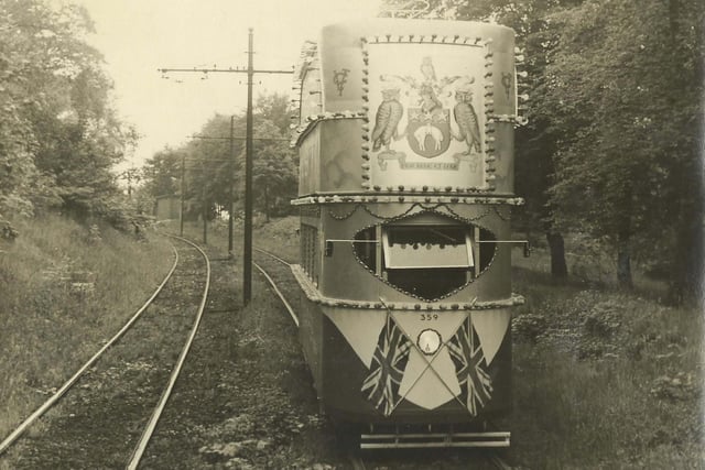 Decorated tram no. 359 travelling through Middleton Woods, with the Leeds Coat of Arms seen at the top. This tram was first decorated for the Festival of Britain in 1951 and was subsequently decorated for various events until 1955.