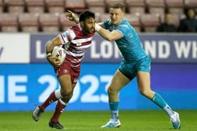 Wigan's Bevan French tangles with Harry Newman during Rhinos' league win last week. Picture by Ed Sykes/SWpix.com.