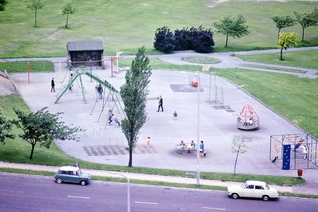 A telephoto view from Morley Town Hall of the children's playground behind the Hopkins Gardens that was set up as part of the Coronation celebrations for Queen Elizabeth II in June 1953. It is seen here with Queensway in the foreground and Fish's field in the background.