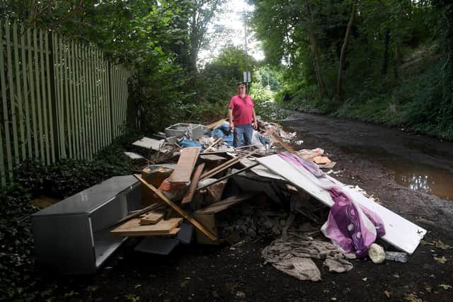 Pictured is Leslie Riley, aged 71, on Ridge Road, Meanwood in Leeds where there is fly tipping and potholes that have caused him grief. Photo: Simon Hulme