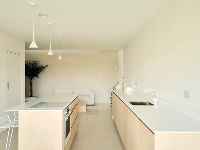 The large and bright open-plan kitchen, living and dining area runs front to back at ground-floor level.