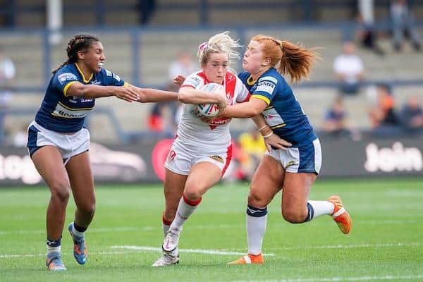 Caitlin Casey, right and teammate Sophie Robinson tackle Paige Travis during Rhinos' loss to Saints. Picture by Allan McKenzie/SWpix.com.