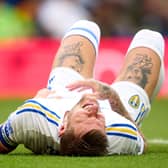 Liam Cooper is injured during Leeds' opening fixture of the 2023/24 season. (Photo by Alex Caparros/Getty Images)
