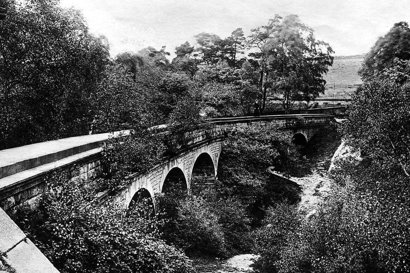 A postcard view of Adel Woods showing the Seven Arches aqueduct circa 1911.
