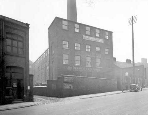 Businesses at East Street Mills, showing John Dickenson & Co. Ltd, Paper manufacturers. Signs for Cooper and Silversides, Joiners and The Service Tailoring Co. Ltd. can be seen. Pictured in June 1935.