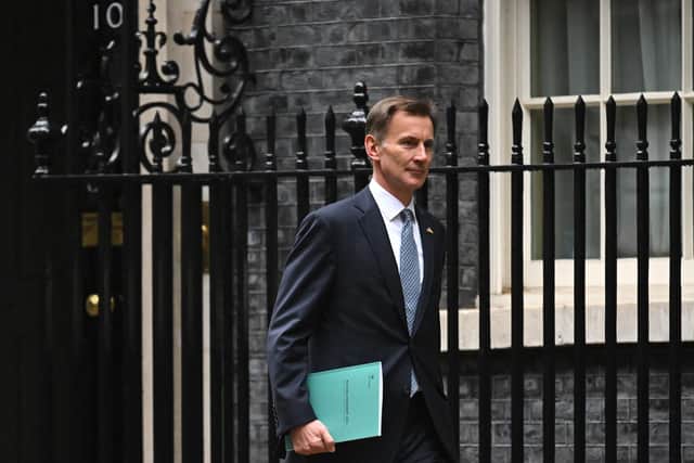 Britain's Chancellor of the Exchequer Jeremy Hunt leaves Downing Street in central London on his way to make a full budget statement in the House of Commons on November 17, 2022.
