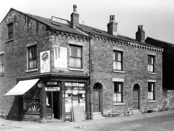 The junction of Mushroom Street (left) and Cambridge Street (right). The shop on the corner is number 30 Mushroom Street, a grocery selling Lyons tea, Typhoo tea, Capstan cigarettes, Lyons cakes, Cherry Blossom polish and Tizer. On the right are numbers 1 and 3 Cambridge Street, two back-to-back terraced houses with a shared outside toilet yard on the far right. Pictured in September 1959.