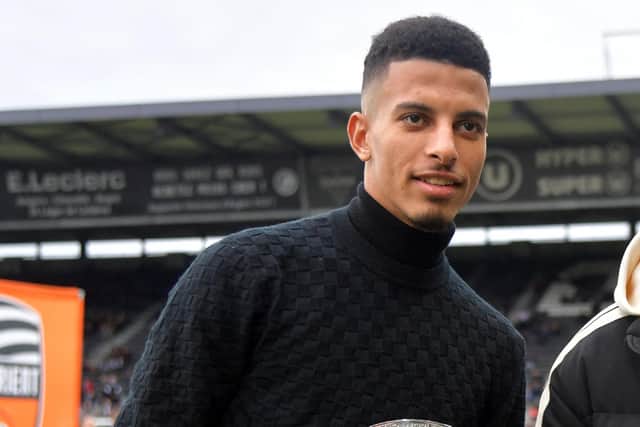 Angers' Moroccan players Azzedine Ounahi (L) and Sofiane Boufal (R) pose with their Qatar 2022 World Cup trophies prior to the French L1 football match between SCO Angers and FC Lorient at The Raymond Kopa Stadium in Angers, western France on January 1, 2023. (Photo by JEAN-FRANCOIS MONIER / AFP) (Photo by JEAN-FRANCOIS MONIER/AFP via Getty Images)