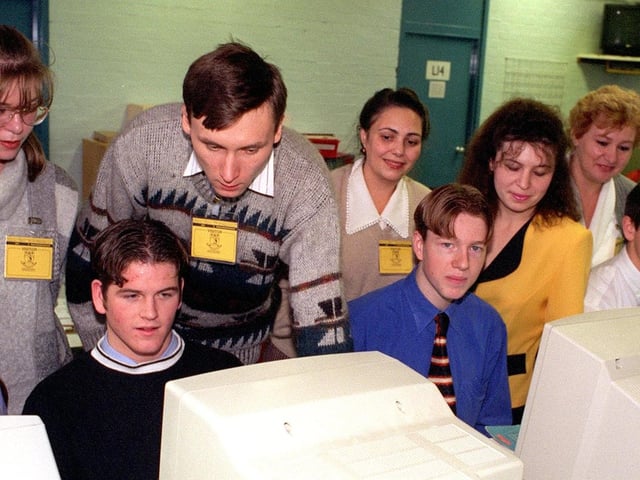 12 Russian teachers visited Garforth Community College in November 1997. Pictured are some of them with sixth form students in the economics and business department.