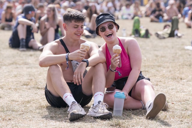 Two festivalgoers take a break for some ice cream.